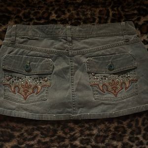 mini green cargo skirt with patter on back pockets